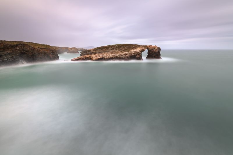 arch, atlantic, beach, cabo, cantabrian, cape, catedrais, cathedral, cliff, clouds, coast, coastline, dusk, erosion, europe, european, evening, famous, foam, galicia, gate, green, landmark, landscape, lugo, monument, natural, nature, ocean, playa, praia,  The Gate of the Windsphoto preview