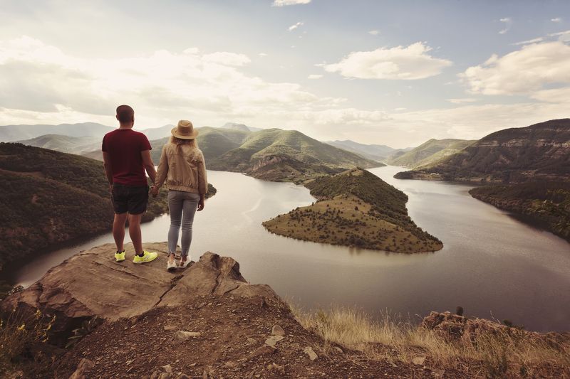 hiking, couple, mountain, travel, adventure, holding, hands, hat, hike, top, view, man, activity, journey, cliff, tourism, standing, woman, freedom, sunset, nature, together, male, trekking, rock, tourist, extreme, destination, climber, sport, sun, beauti Hiking couple looking at the view holding handsphoto preview