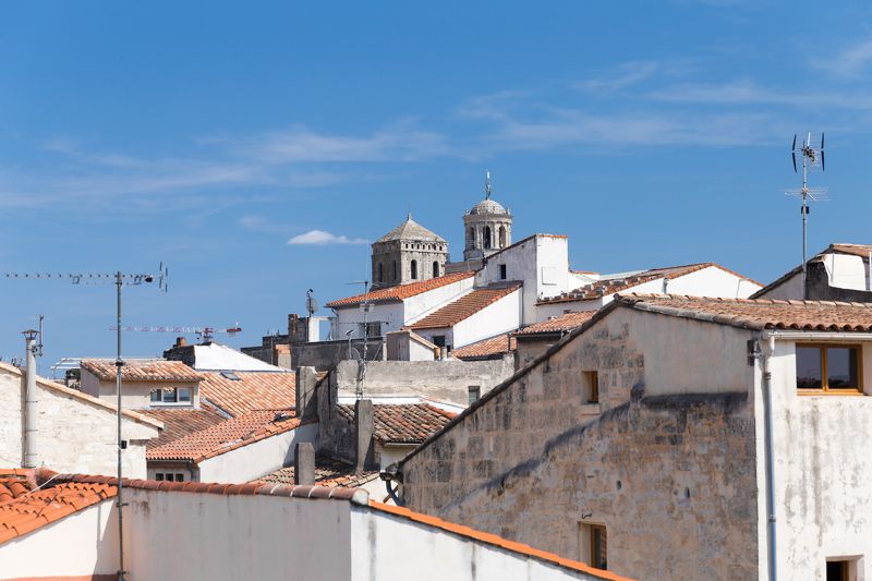 France Roofs city architecture sky cathedral tile old city steps clouds tranquility summer Roofs of Arlesphoto preview