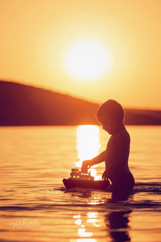 childchood, summer, sea, boy, play, boat, sunset summerphoto preview