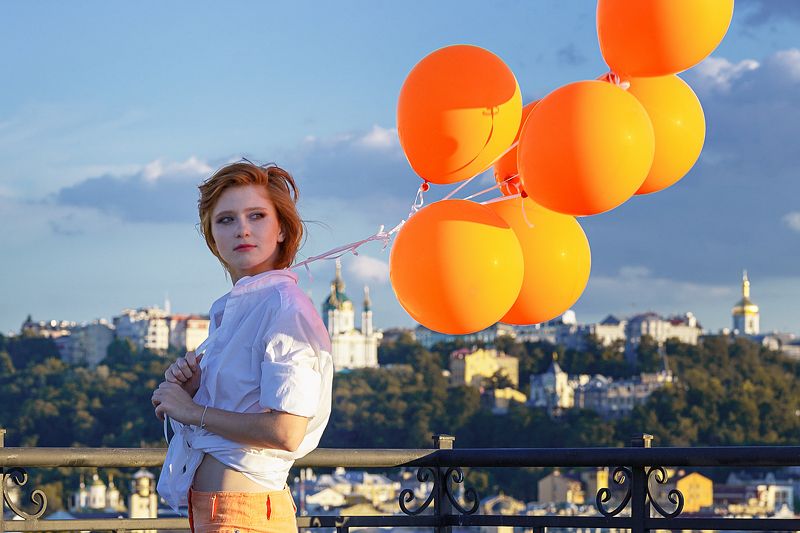 Zhdanova theatre roof Kiev Ukraine actress theater orange red girl balls city view panorama beautiful young girl Orange moodphoto preview