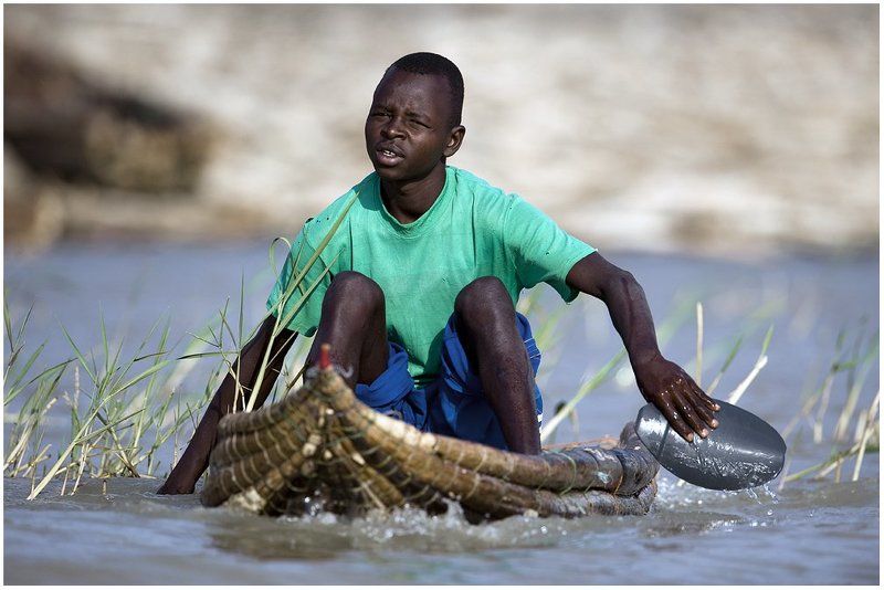 баринго, лодка, рыбак Торговец рыбой.photo preview