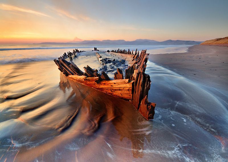 ireland, kerry, rossbeigh, sunset, wreck, boat, ship, beach, iconic, mountains. color, red Wreckedphoto preview