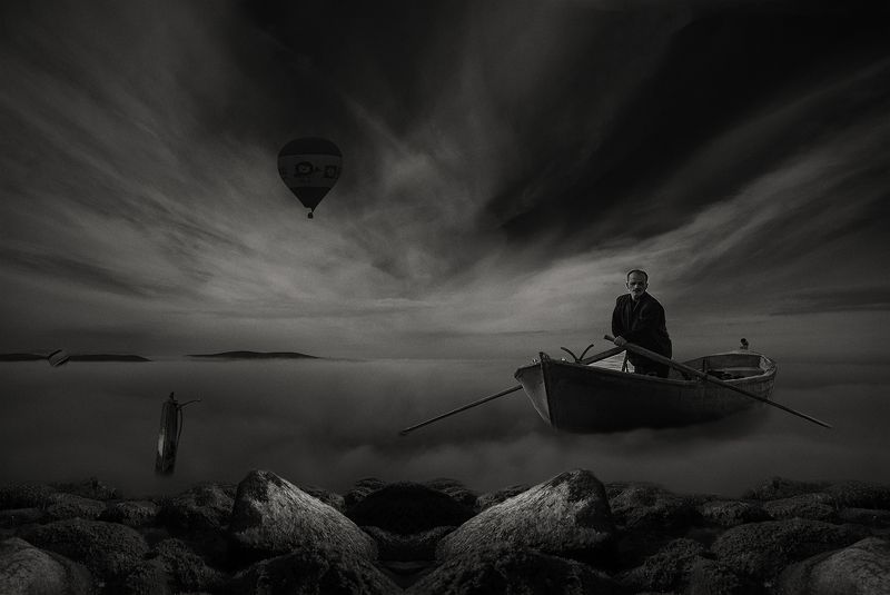 clouds,boat.rocks clouds and boatphoto preview