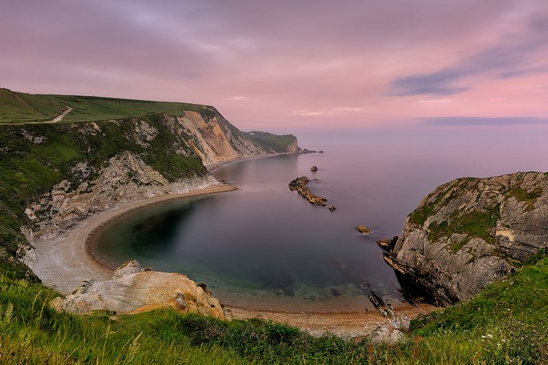 Dorset coast, North Sea, UK, long exposure, sunset, Jurassic coast, summer Soft sunset and light pink haze above Man O\' War Beach. Dorset coast. photo preview