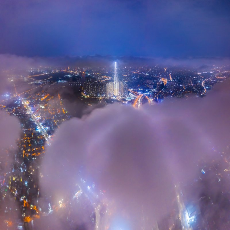 building, clouds, vietnam The tallest building in Vietnam is covered with clouds.photo preview