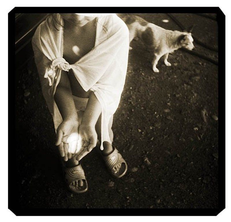 Hands full of lightphoto preview