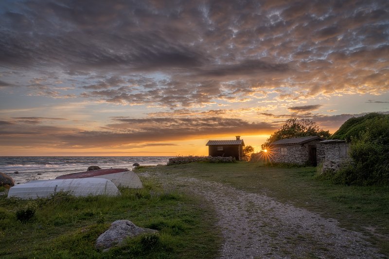 Baltic Sea, balticsea, Beach, boat, chalkstone, chalkstonehuts, Clouds, Coast, coastal, eveningmood, fishermen´svillage, Fishing, fishingboat, fishingstation, fishinvillage, Gotland, Island, kettelvik, naturallightphotography, nature, pebblebeach, Scandin Klasens Bodar Fishing Villagephoto preview